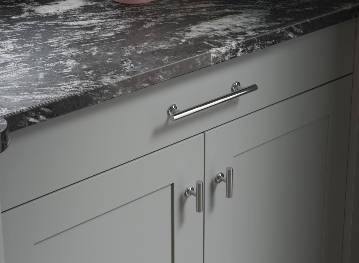 Cloud grey Shaker Door cabinets with chrome handles and stone worktop
