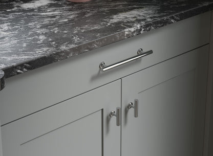 Cloud grey Shaker Door cabinets with chrome handles and stone worktop