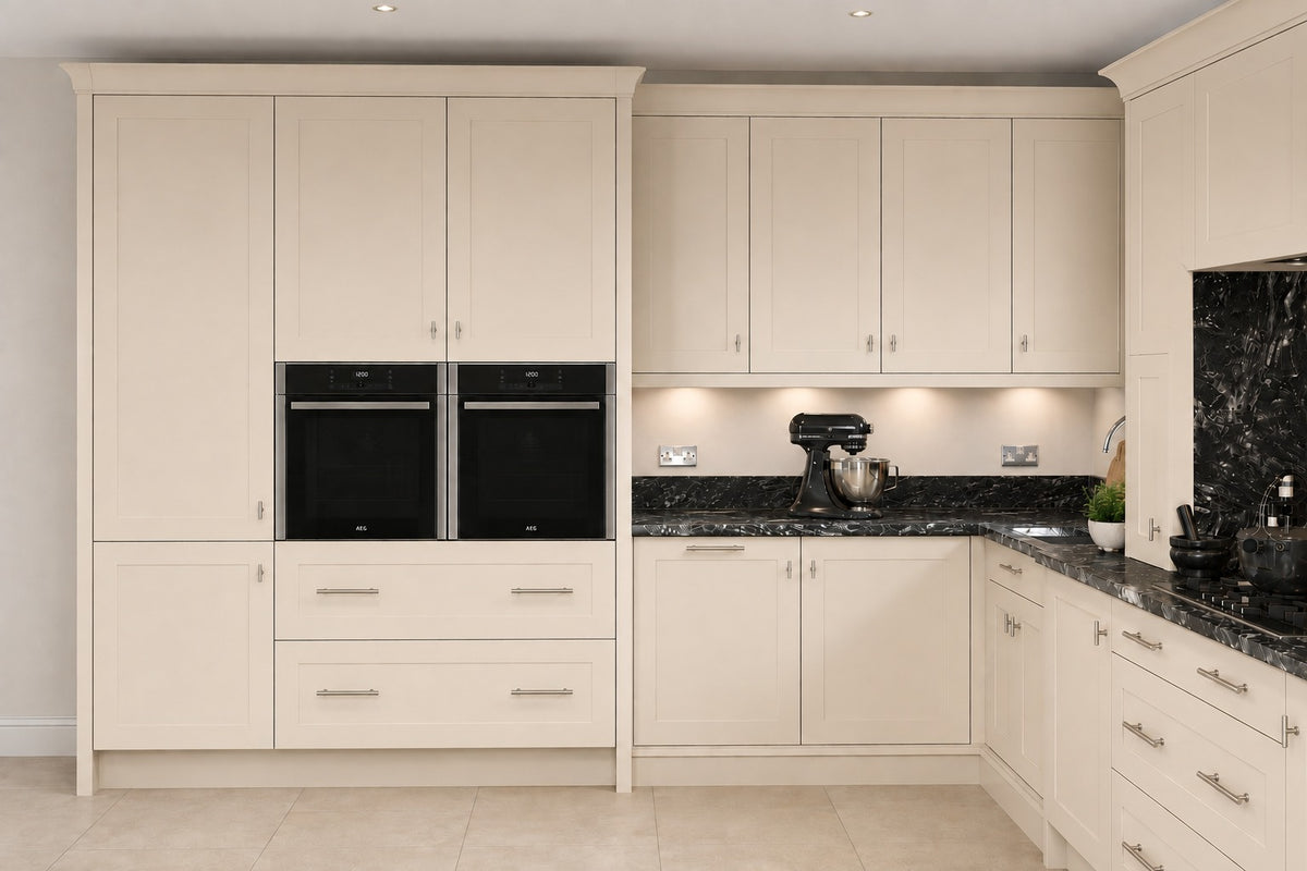 Ivory cream Shaker Door kitchen with double ovens and black stone worktops