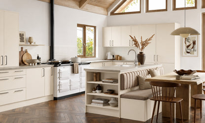 Ivory cream Slab Door kitchen with island seating and range cooker