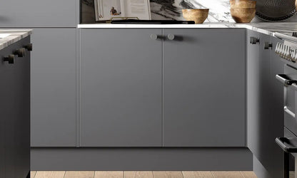 Anthracite grey Slab Door base cabinets with round handles and marble splashback