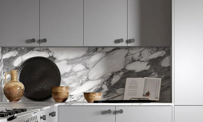 Cloud grey Slab Door wall cabinets with round handles and marble splashback