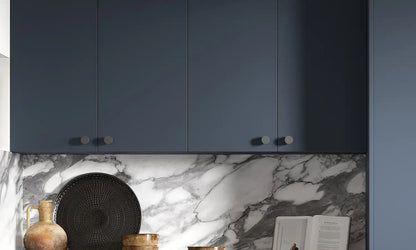 Indigo blue Slab Door wall cabinets with round handles and marble splashback